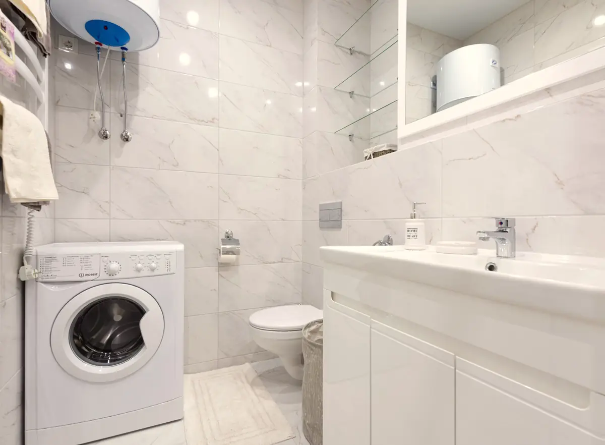 Bright laundry room with a wall-mounted water heater