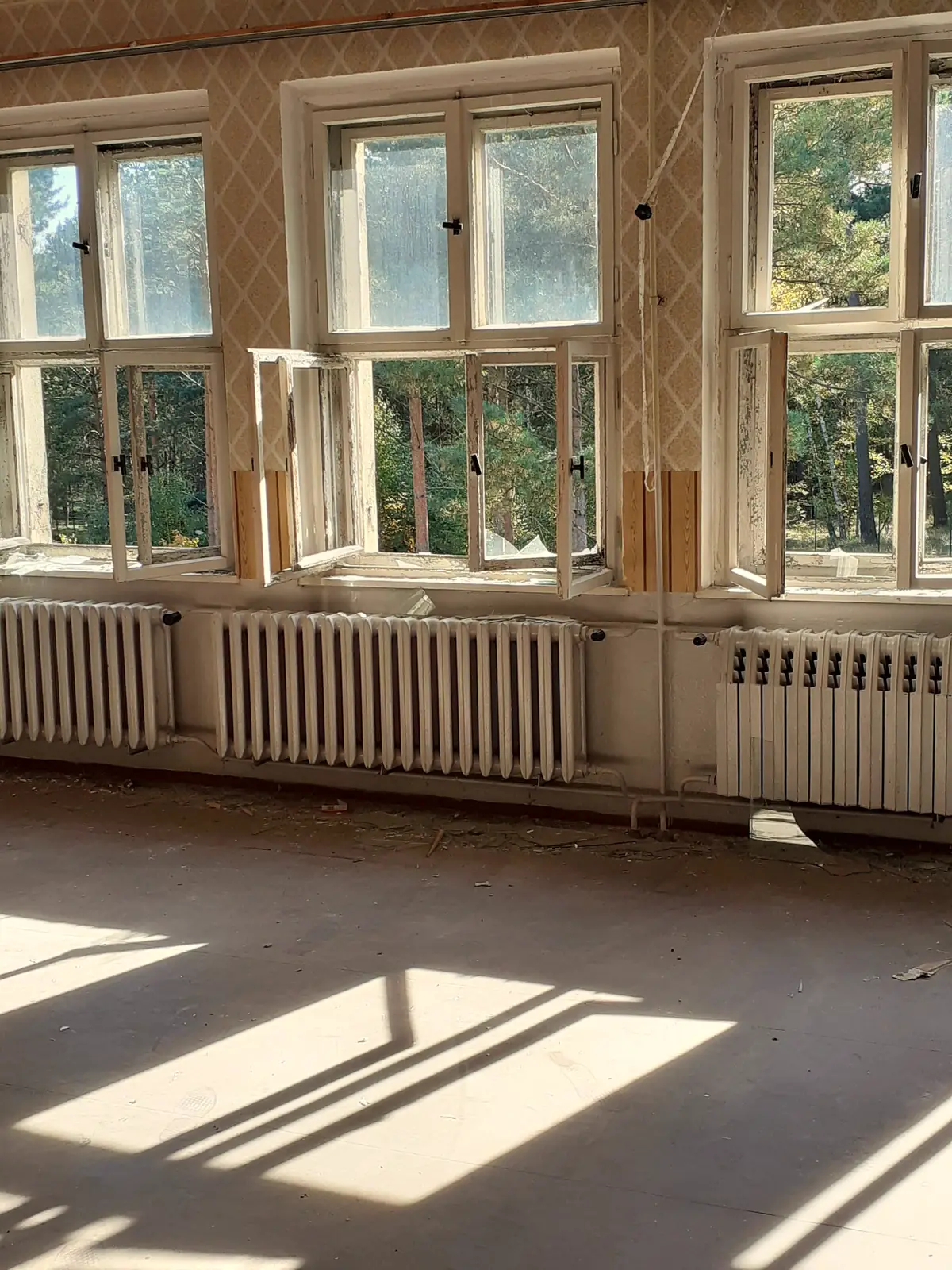 Cast-iron radiators under tall windows